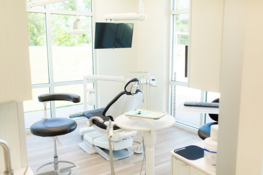 Bright doctor room showing patient chair